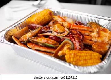 A View Of A Tin Container Of Seafood Boil, In A Restaurant Or Kitchen Setting. 