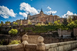 View Of Toledo, Castila La Mancha, Spain, World Heritage City With The Alcazar High Above On A Bright Day