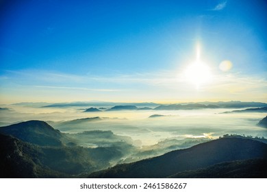 The view from the top of Adam's Hill in Sri Lanka, a beautiful view between the distant mountain peaks through the mist with sunrise - Powered by Shutterstock