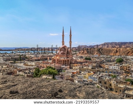 View from the top of the cliff down to the Old Market and Al Sahaba Mosque on the Red Sea promenade in Sharm El Sheikh, Egypt. Beautiful exotic panorama of a tropical Egyptian town