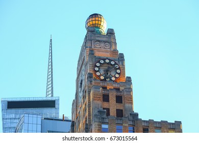 View Of Top Of The Paramount Building With The Ball And The Clock At Sunset