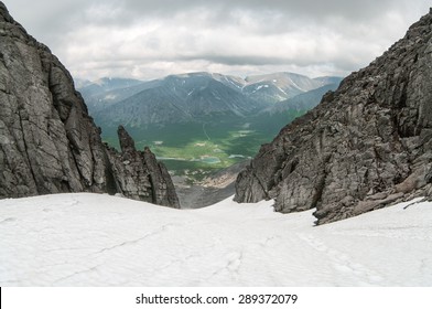 View From The Top Of Snowy Mountain Pass At Valley, Summer Season, Khibiny Mountains In Russia