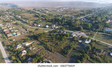 View from the top of the village. Houses and gardens. Countryside, rustic landscape. Aerial photography.