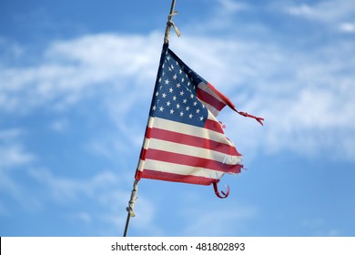 View at torn American flag