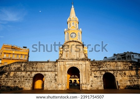 View to Torre de Reloj (Clock Tower) with blue sky and warm light, Cartagena, Colombia, Unesco World