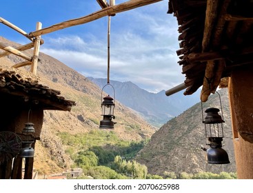View of Toubkal National Park from a beautifully decorated rooftop terrace at a Berber homestay in the High Atlas Mountains. Imlil valley, Morocco.