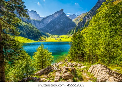 View to tourquise clear Seealpsee with the Swiss Alps (mountain Santis) in the background, Appenzeller Land, Switzerland