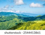 A view towards the coast from the rim of the Furnas Caldera on the island of Sao Miguel in the Azores in summertime