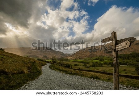 View towards distant Langdale Pikes and Little Langdale Tarn, taken from the Little Langdale Valley, Lake District National Park, UNESCO World Heritage Site, Cumbria, England, United Kingdom, Europe