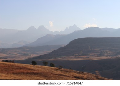 View towards the Drakensberg mountains with Cathedral Peak in the distance during winter time - Shutterstock ID 715914847