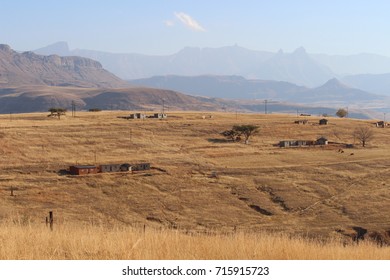 View Towards The Drakensberg Mountains With The Rural Landscape Of Kwa Zulu Natal During The Dry Winter Time