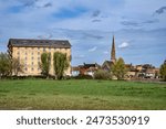 A view towards the former Victorian Millhouse, the river Great Ouse, and the URC Free Church in St Ives, Cambridgeshire, England.