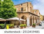 A view towards the side of the Rome Square in the center of the city in Urbino, Italy in summertime