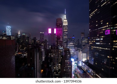 A View Towards The Skyscrapers Of Midtown Manhattan At Night