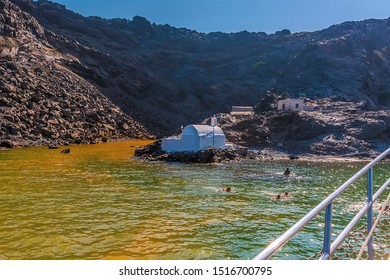 A view towards the thermal springs on the volcanic island of Palea Kameni, Santorini in summertime