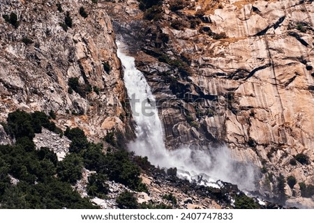 View towards Wapama falls dropping along granite walls; Hetch Hetchy Reservoir area, Yosemite National Park, Sierra Nevada mountains, California 商業照片 © 