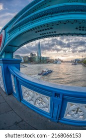 View From Tower Bridge Against Thames River With Tourist Boat In London, England, UK