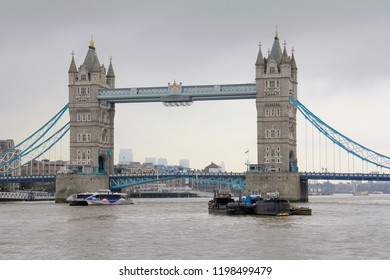View of tower bridge in London, England with cloudy grey sky