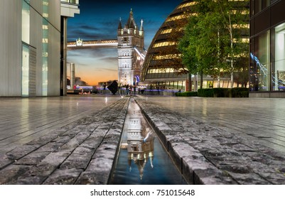 View to the Tower Bridge with reflection in the water in London, United Kingdom