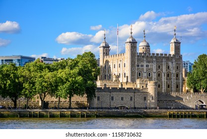 View Of The Tower Of London, A Castle And A Former Prison In London, England, From The River Thames. The Tower Of London, Today A Museum, Is A Fortified Complex That Includes Multiple Buildings