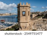 A view from Floriana’s tower in Malta, offering a see-through perspective towards Valletta, capturing the historic skyline.