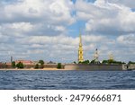 View of the tower and spire of the Peter and Paul Fortress in St. Petersburg from the Neva River