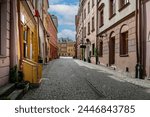 View of traditional colored tenements houses on the Old Town of Lublin city during sunny spring day.