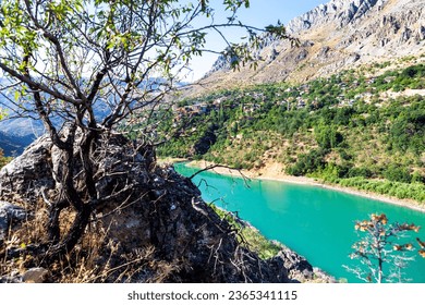 View of traditional Erzincan Kemaliye houses, the Dark Canyon and Euphrates River, during the summer season. These houses, built on steep cliffs, are still used today. - Shutterstock ID 2365341115