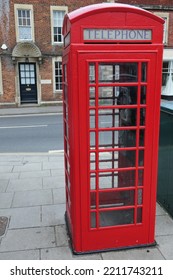 View of a traditional old style British red phone box on a London street