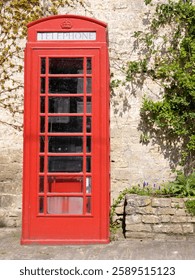 View of a traditional old style British red phone box on a London street