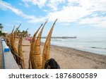 A view of the traditional reed boats called "caballito de totora" on the shore, Huanchaco, near Trujillo, Peru.