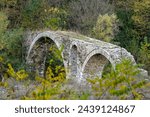View of a traditional stone bridge at Kosynthos river in Thrace, Greece