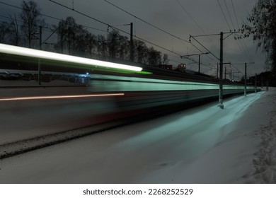 View of a train at night at winter. Long exposure shot.