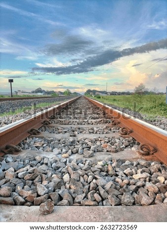 view of the train tracks with a beautiful cloud background like in anime