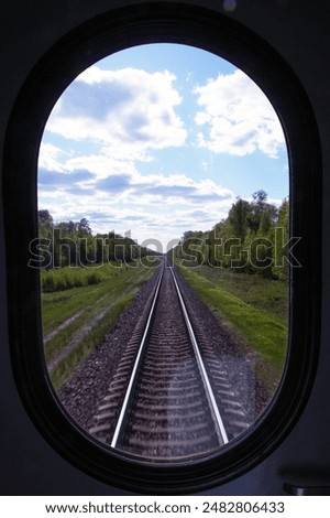 View from the train window of the railway and the landscape