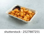 A view of a tray of tater tots.