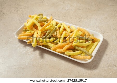 A view of a tray of veggie straw chips.