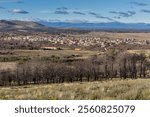 View of trees, burned mountain in forest fire and the town of Ferreras de Abajo from the Mirador de La Pedrizona, Zamora, Castilla y León, Spain.