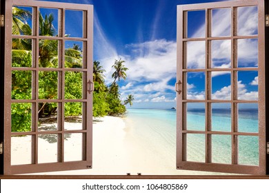 View of a tropical beach through a window