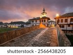 View of Tryavna, Bulgaria. The Clock Tower and the old Stone Bridge in the old town in the architectural traditional complex at sunrise. Region of Gabrovo. National revival Bulgarian architecture.