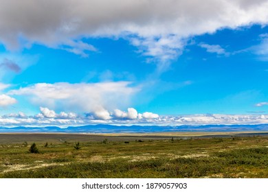 View Of The Tundra And The Mountain Range On The Horizon In The Subpolar Urals On A Summer Day