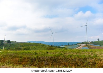 View of turbine on mountain. Windmill turbine field for electric production with blue sky at Khao Kho, Phetchabun, Thailand. Power and energy concepts