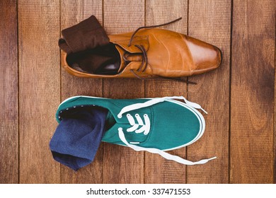 View Of Two Different Shoes On Wood Plank