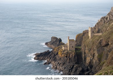 View Of The Two Ruined Engine Houses Of The Crown Mines , Botallack, Cornwall Perched On A Cliff Overlooking The Undersea Shaft Extending Under The Ocean Floor In Search Of Tin, Now A Heritage Site