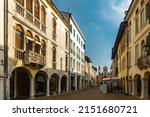 View of typical old town street in historical center of Pordenone in sunny autumn day, Italy