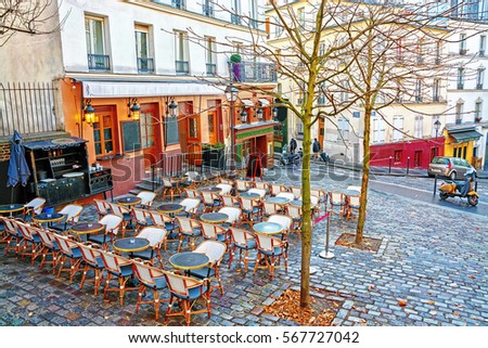  View of typical paris cafe in the artists' quarter Montmartre in Paris at morning, France