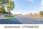 View of the typical suburban neighborhood on a summer morning.