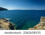 view of the Tyrrhenian Sea near the Baratti promontory.  in the background you can glimpse the island of Elba.  barters.  plummet.  Livorno.  Tuscany