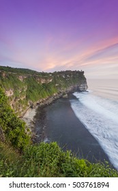 View of Uluwatu temple cliff with pavilion and blue sea in Bali, Indonesia

