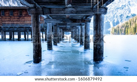 View from under the pier onto the frozen Lago di Braies